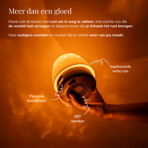 Havie met ingebouwde witte ruis en 360-gradenspeaker verspreidt een warme oranje gloed.